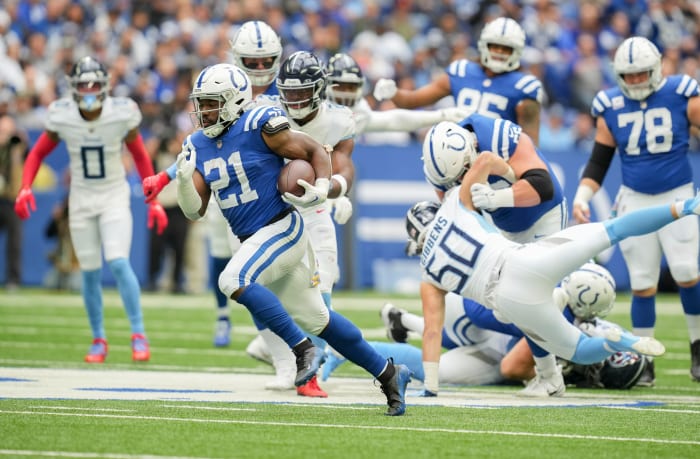 Oct 8, 2023; Indianapolis, Indiana, USA; Indianapolis Colts running back Zack Moss (21) rushes the ball for a touchdown during a game against the Tennessee Titans at Lucas Oil Stadium.